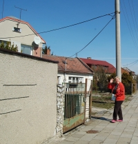 Jitka Coufalová in front of her house