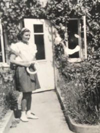 Sister Adéla in front of her grandmother Marie Podzimková's house, after the war, before the confiscation of property