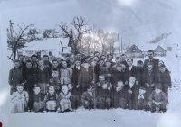 Children in the yard of the school in Čierna Lehota, in the background you can see the stables where Jewish families survived the rest of the war