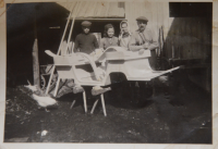 Her parents and older siblings in a wheelwright shop