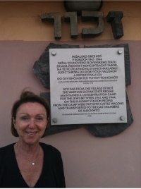 Eva at the train station by the memorial plaque in Nováky