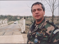 Lt. Col. Štefan Jangl near the bridge built by Slovaks near the eastern Slovak village of Berak, 1997