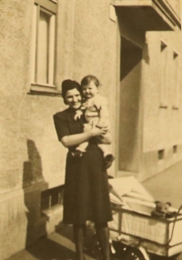 Anežka Weissová (Veselá) with little Tomáš Veselý in front of the barn in Stará Tura, Slovakia, where they lived during the war