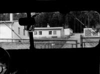 View of the company in Tři Sekery near Mariánské Lázně from the access road, from a GAZ car, ca. 1968/1969