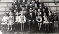 In the second class in Nemcice, Ludmila Novotná first from the right in the front row, ca. 1943