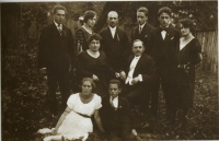 Mum first from the left with dad, mum's siblings, parents in the middle