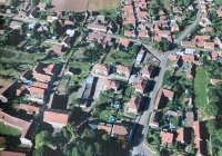 Marking of the land that originally formed the farm of Václav Stehlík. Three apartment houses were built by JZD ( united agricultural cooperative) on the site of the garden and farm buildings