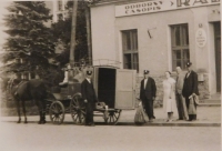 Parents in front of the post office in Předmostí near Přerov