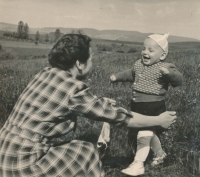 With his mother, 1956