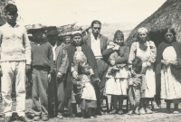 Serafina Varra's family in front of the ruca (traditional Mapuche house type)