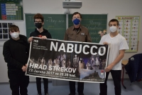 The witness with pupils from Proboštov Primary School with an advertisement for the opera Nabucco, in which he performed, 2021