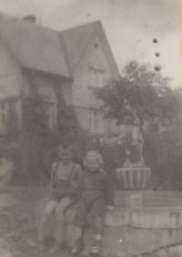 With brother Zdeněk in front of the family gardening centre in Police nad Metují, 1957