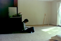 Son Pavel in their first American flat without furniture, 1985