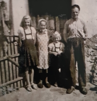 Marie Mikolášková on the left, with her parents and sister, 1941