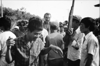 Jiří Lukš among villagers, Laos, 1986