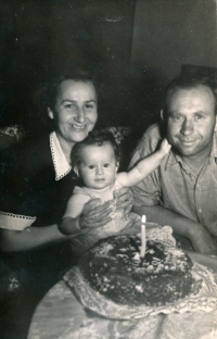 With her parents as a one-year-old, August 1952