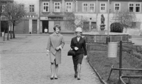 The witness (left) with her sister Stanislava, in the background behind them the house where the witness's family lived, 1965