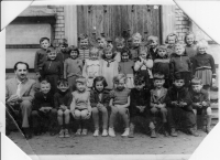 Witness in striped in the front row, center, 1st class photo at 3. ZDŠ in Most in Fučíkovy sady Street