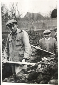 Jan Tomeček (left) excavating the trench for a water pipe for the local school, Tvarožná Lhota, 1961