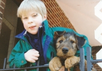 Eva Hejda's son Tomas Krakova with the family dog, ca. 1997