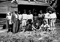 Villagers in Radoma, threshing grain, World War II