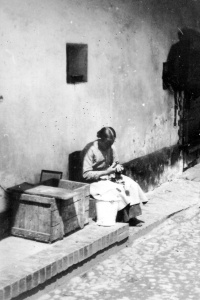 Mother Emilie Kubná at the house that burned down