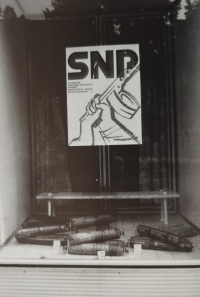 SNP poster in a window with salami, from the book Bob Pacholík - PHOTOGRAPHY - PROSTĚJOV (1985-1987)