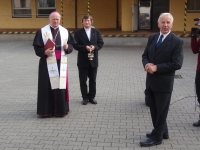 Bishop blessing the new photovoltaic power plant on the roof of the bakery in Dolní Benešov in 2008, Arnošt Obrusník standing on the right