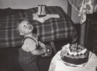 Jiří Podlipný celebrating his first birthday in his grandparents' apartment in Tuhnice, 1970