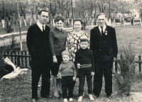 Sasha with his younger brother Yuri, parents, grandparents in a city park, Pokrovka, 1968.