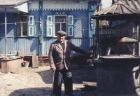 Grandfather Vasil Akimovich Kozan in the yard of his house.