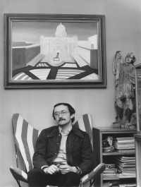 Jan Rajlich Jr at age 31 in his apartment at Úvoz 88, sitting under his own oil painting of St. Peter's Square in Rome titled "The Pope"; photo Boh. Marčák