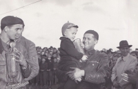 Jaroslav Douša Sr with his son Jaroslav holding a cup - the prize for winning a motor race, 1952