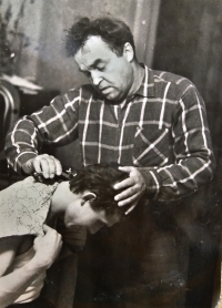 Viacheslav Babak's father gives his son an army buzzcut, 1962