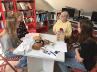 Filming an interview with Mrs. Maříková in the library of the Gymnasium Česká