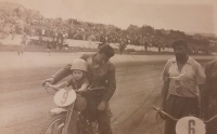 With my father on a motorbike during races, 1950s