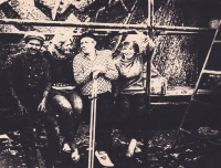 Hennadii Hrytsenko, Alla Horska, Hryhorii Synytsia, Halyna Zubchenko sitting in front of the Prometheis mosaic panel, mid 1960s
